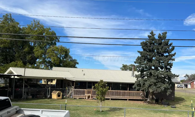 a view of a food mall next to a yard