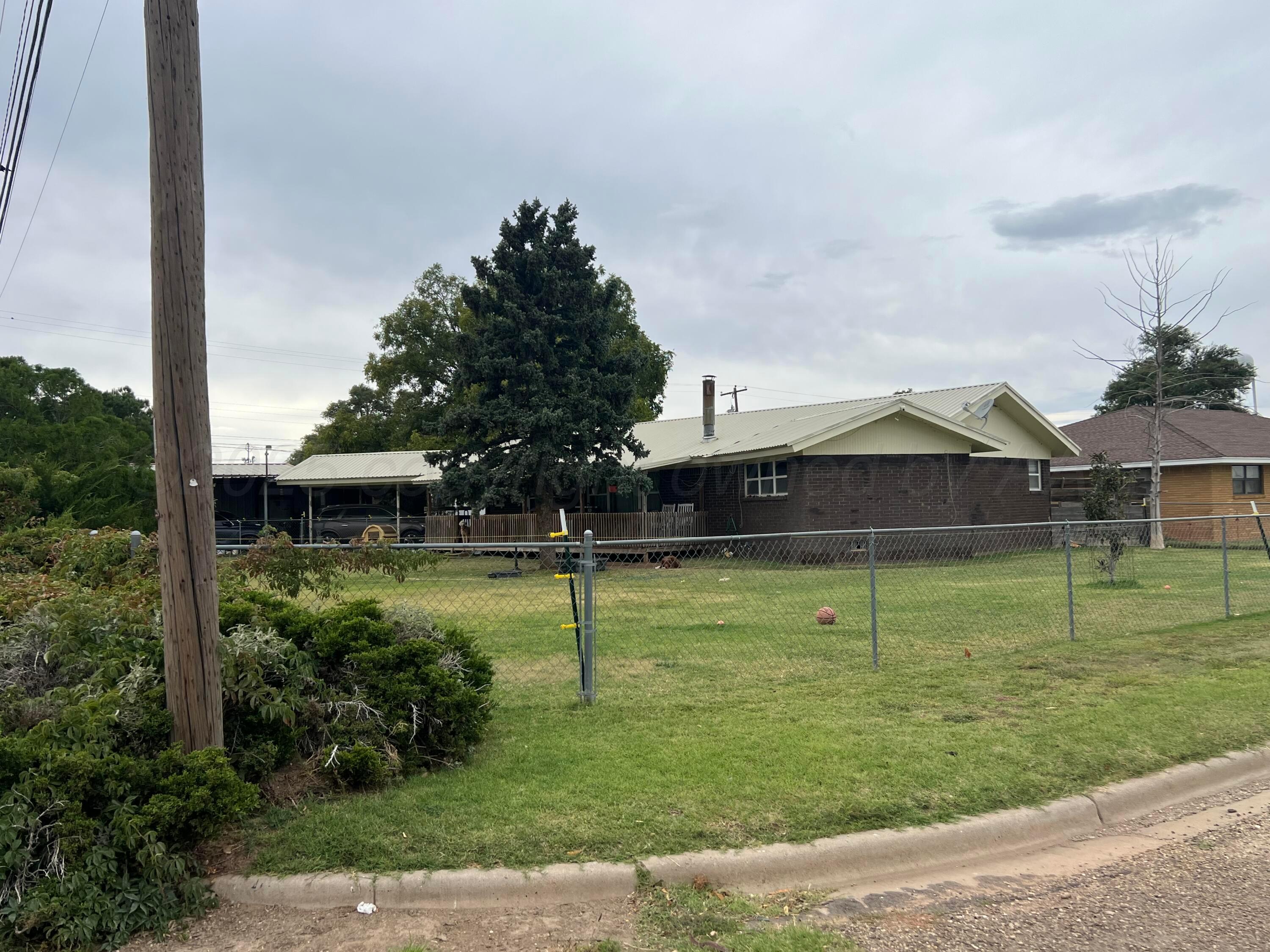 310 East 12th Street Friona, TX 79035 - Photo 2 of 10 a view of a house with a yard