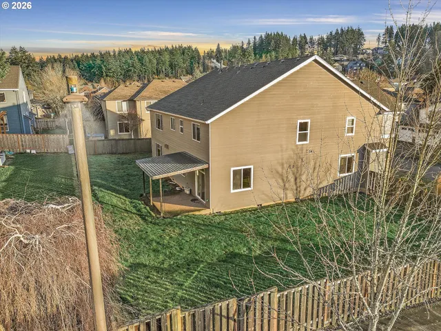 a aerial view of a house with a yard