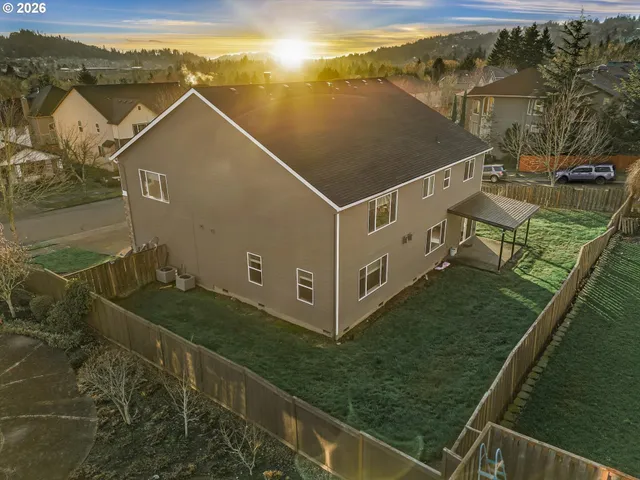 a view of a backyard with sitting area