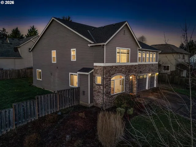 a front view of a house with yard