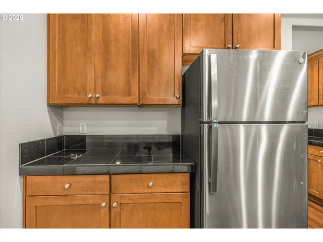 a kitchen with appliances and cabinets