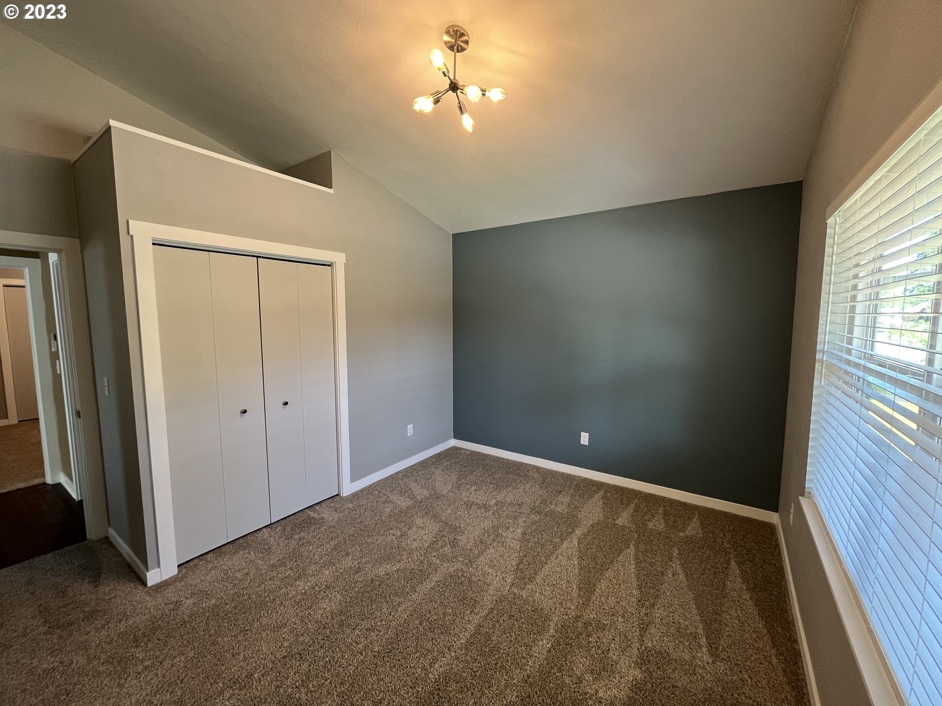 1062 B Street Springfield, OR 97477 - Photo 15 of 33 wooden floor in an empty room with a window