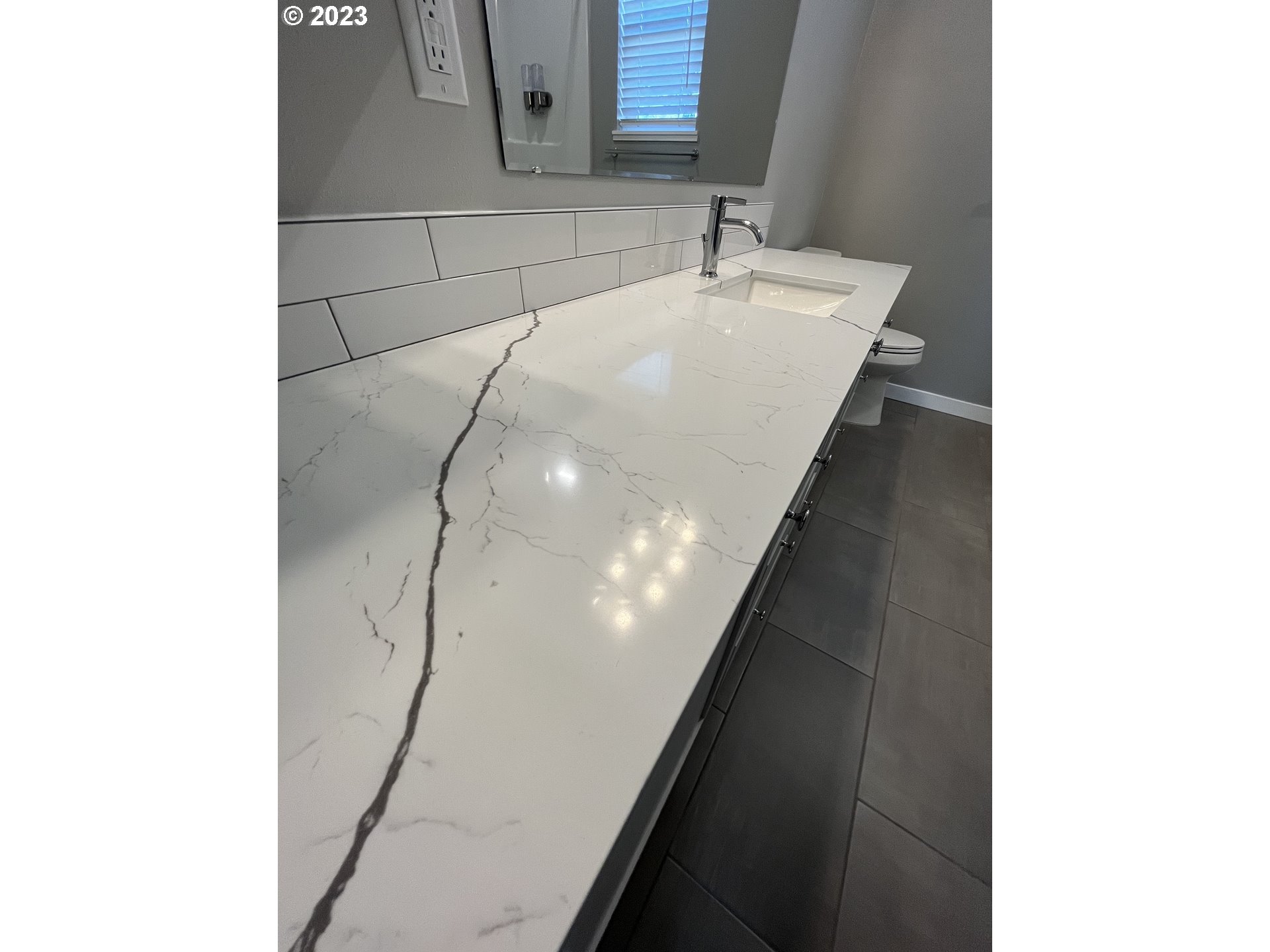 1062 B Street Springfield, OR 97477 - Photo 18 of 33 a bathroom with a sink and a mirror