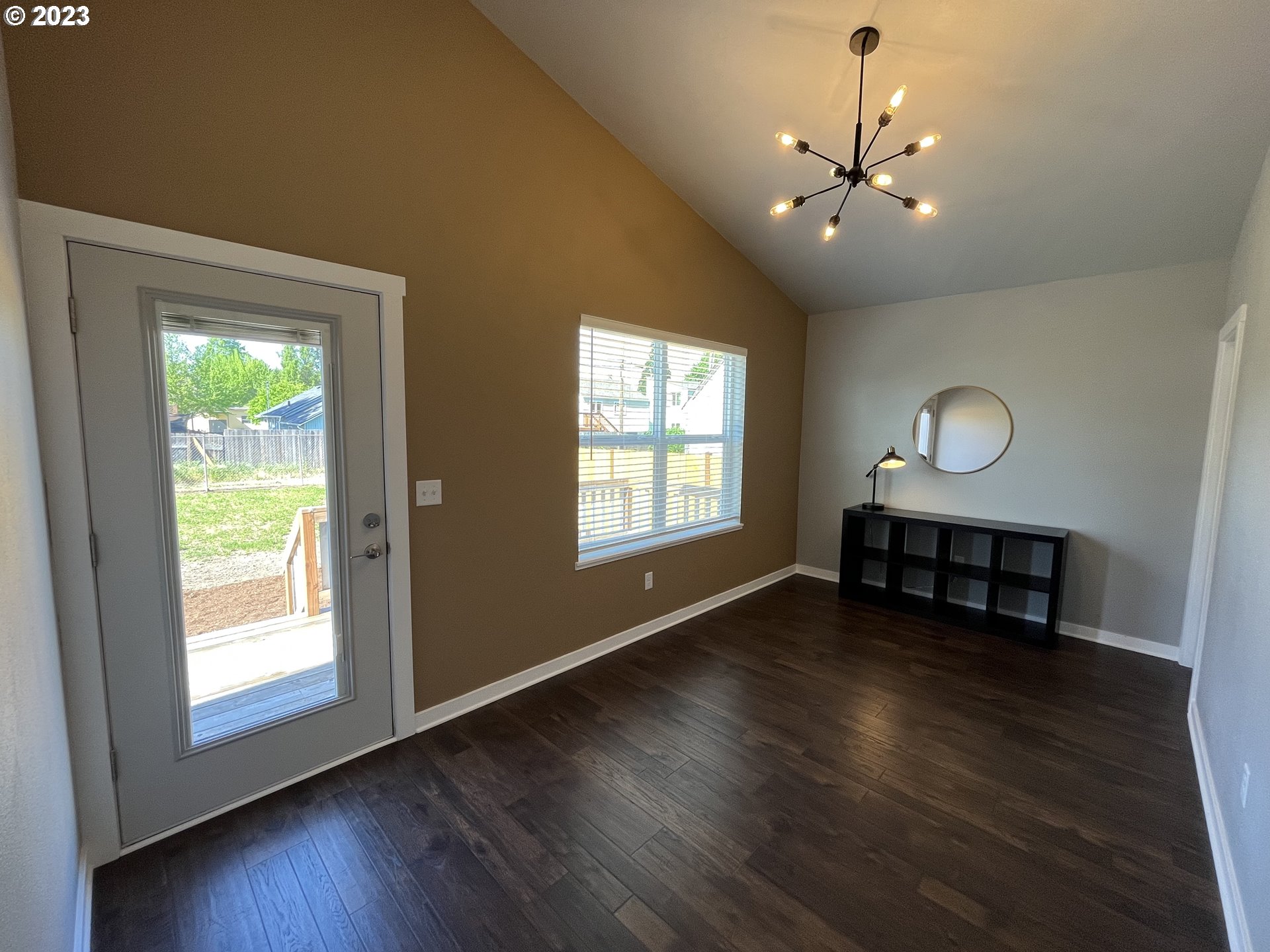 1062 B Street Springfield, OR 97477 - Photo 20 of 33 a view of an empty room with wooden floor and a window