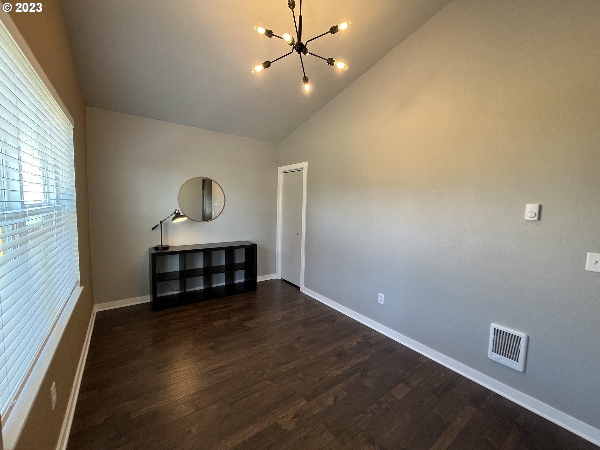 1062 B Street Springfield, OR 97477 - Photo 21 of 33 wooden floor in an empty room with a window