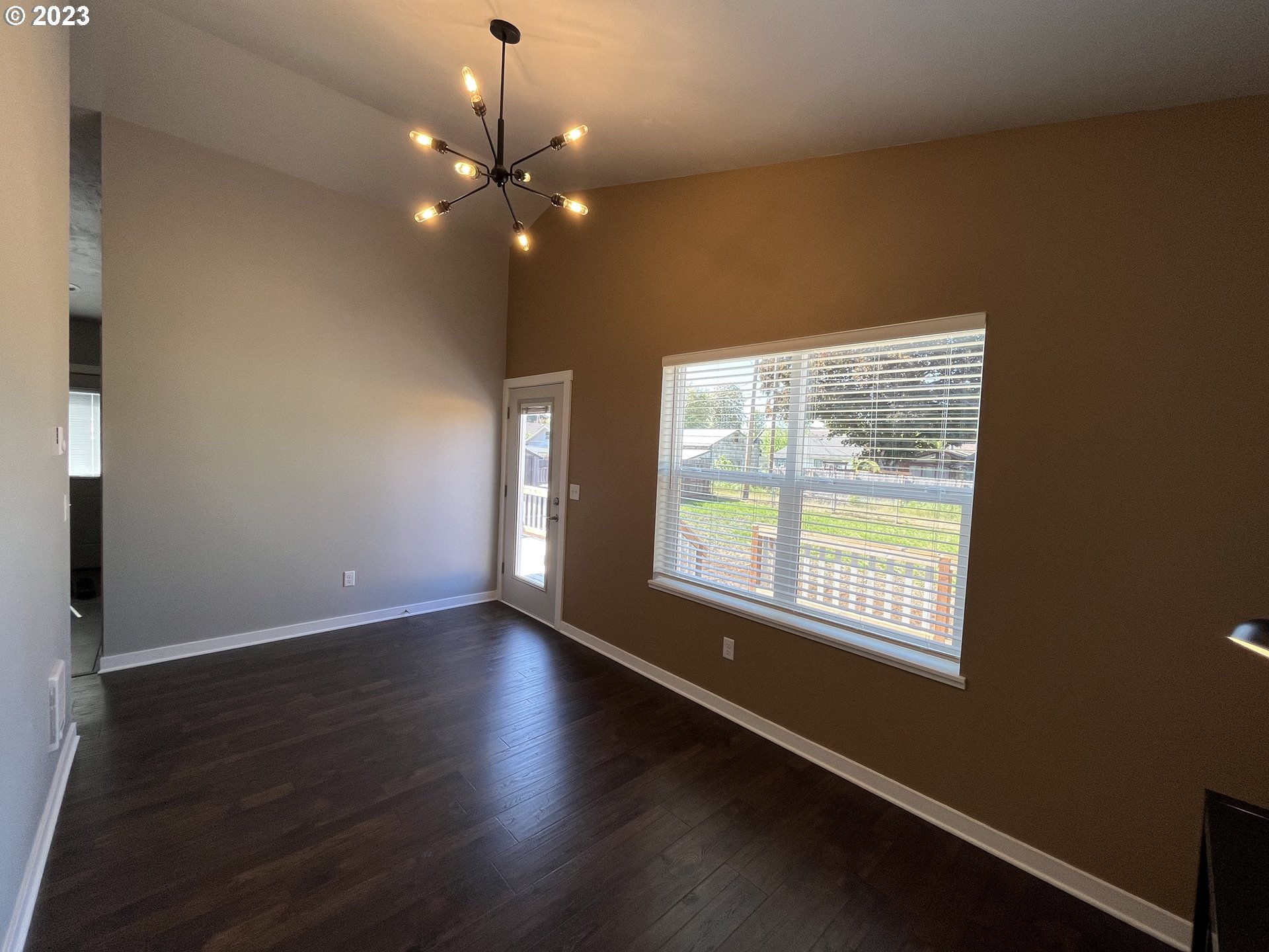 1062 B Street Springfield, OR 97477 - Photo 22 of 33 an empty room with wooden floor and windows