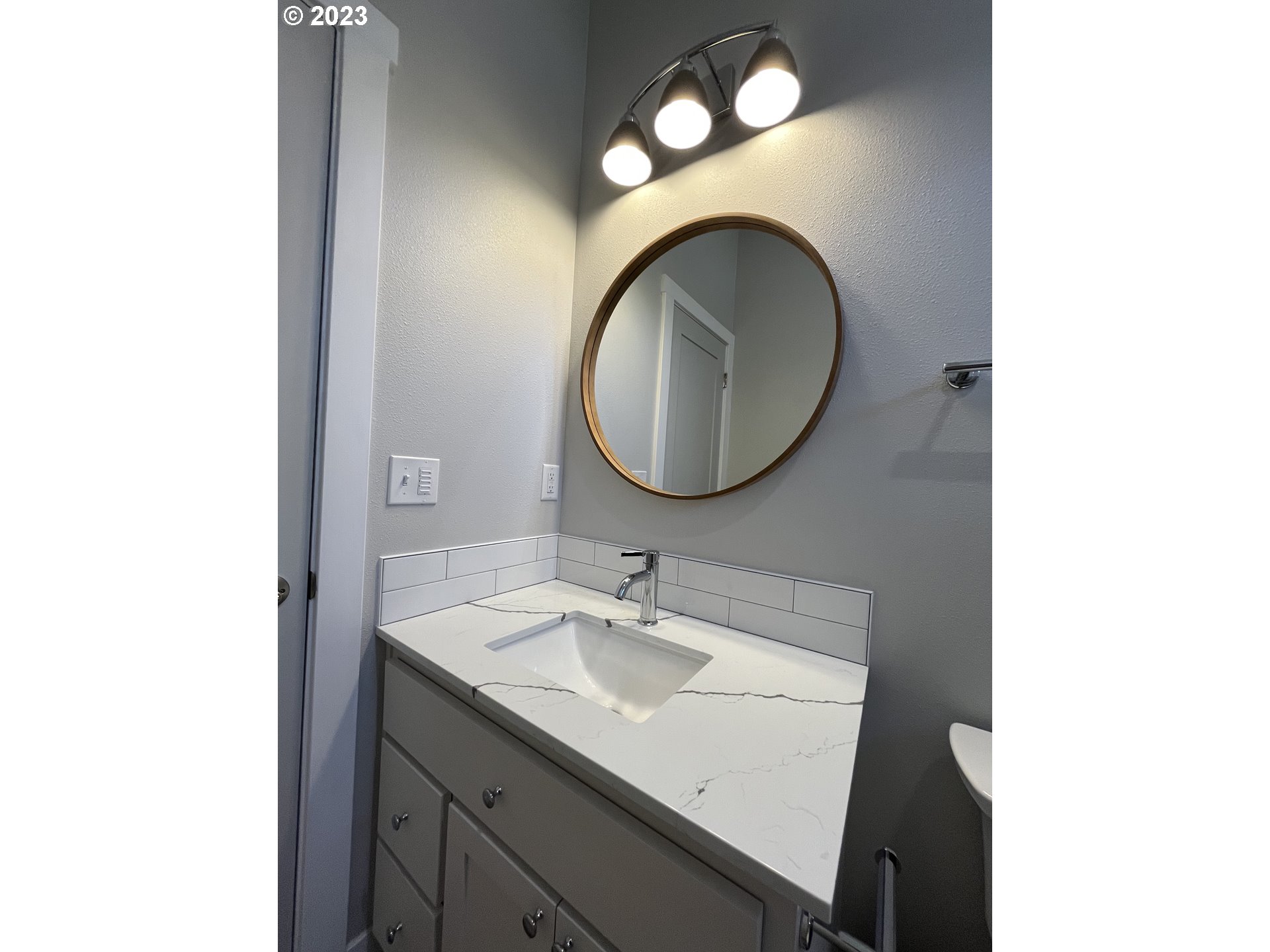 1062 B Street Springfield, OR 97477 - Photo 24 of 33 a bathroom with a sink and a mirror