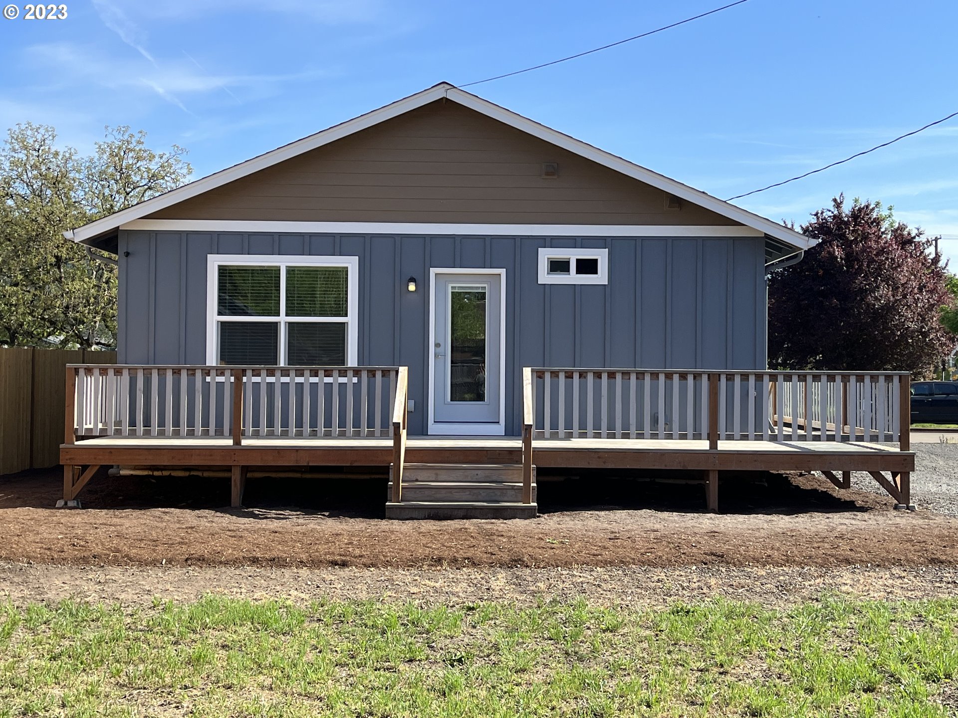 1062 B Street Springfield, OR 97477 - Photo 28 of 33 a view of a house with a wooden deck
