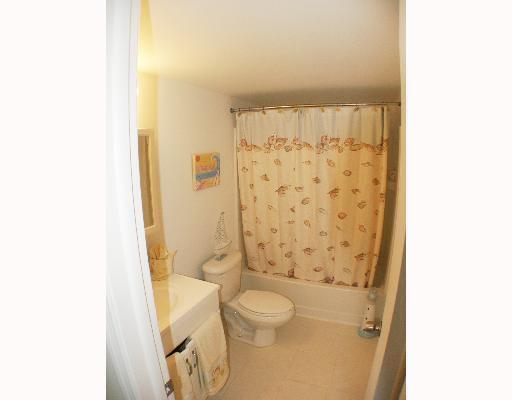 1505 Crescent Circle, Unit C30 Lake Park, FL 33403 - Photo 5 of 5 a bathroom with a toilet and shower curtain