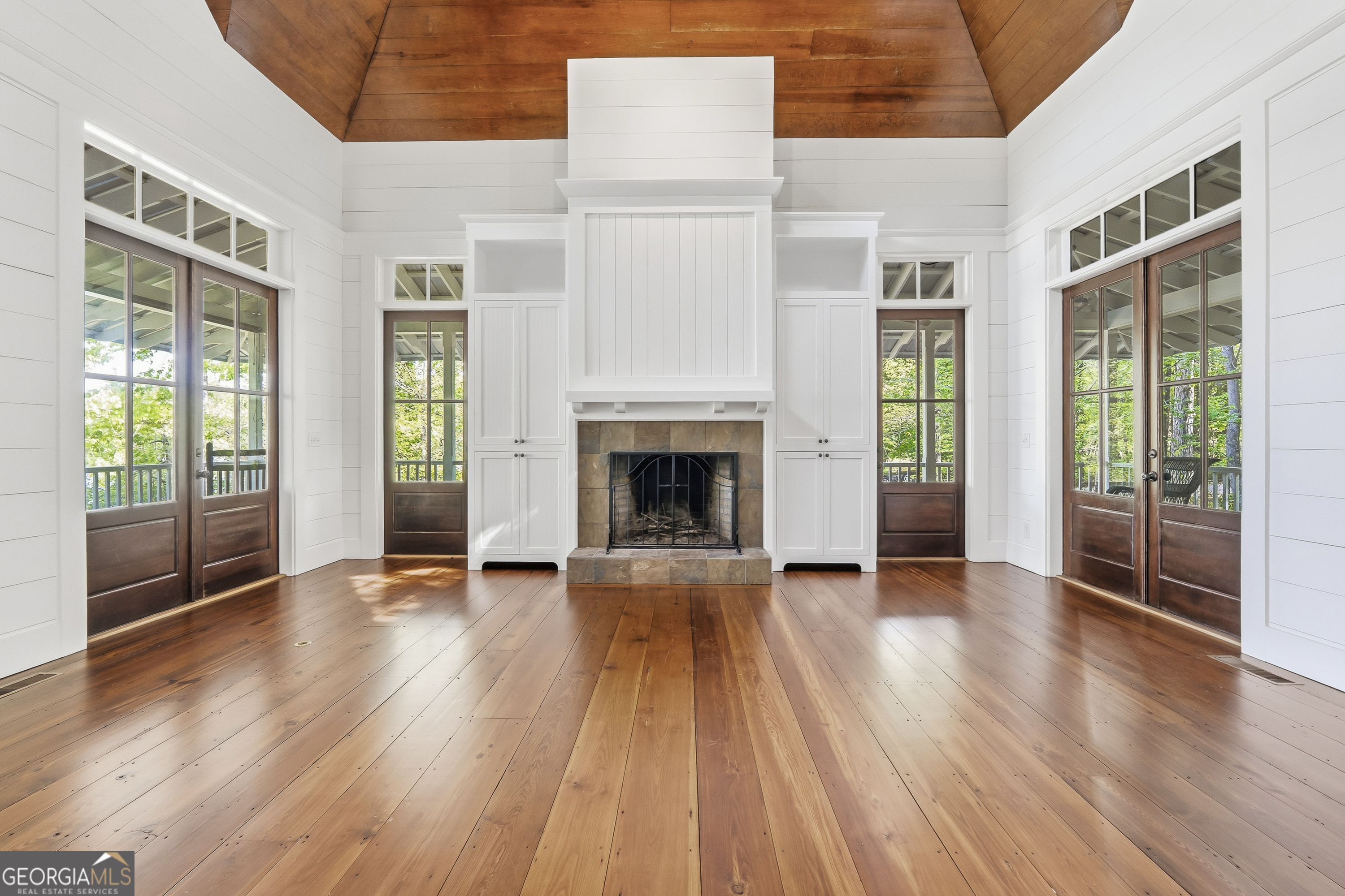 57 Birch Lane Sparta, GA 31087 - Photo 14 of 61 a view of an empty room with wooden floor and a window