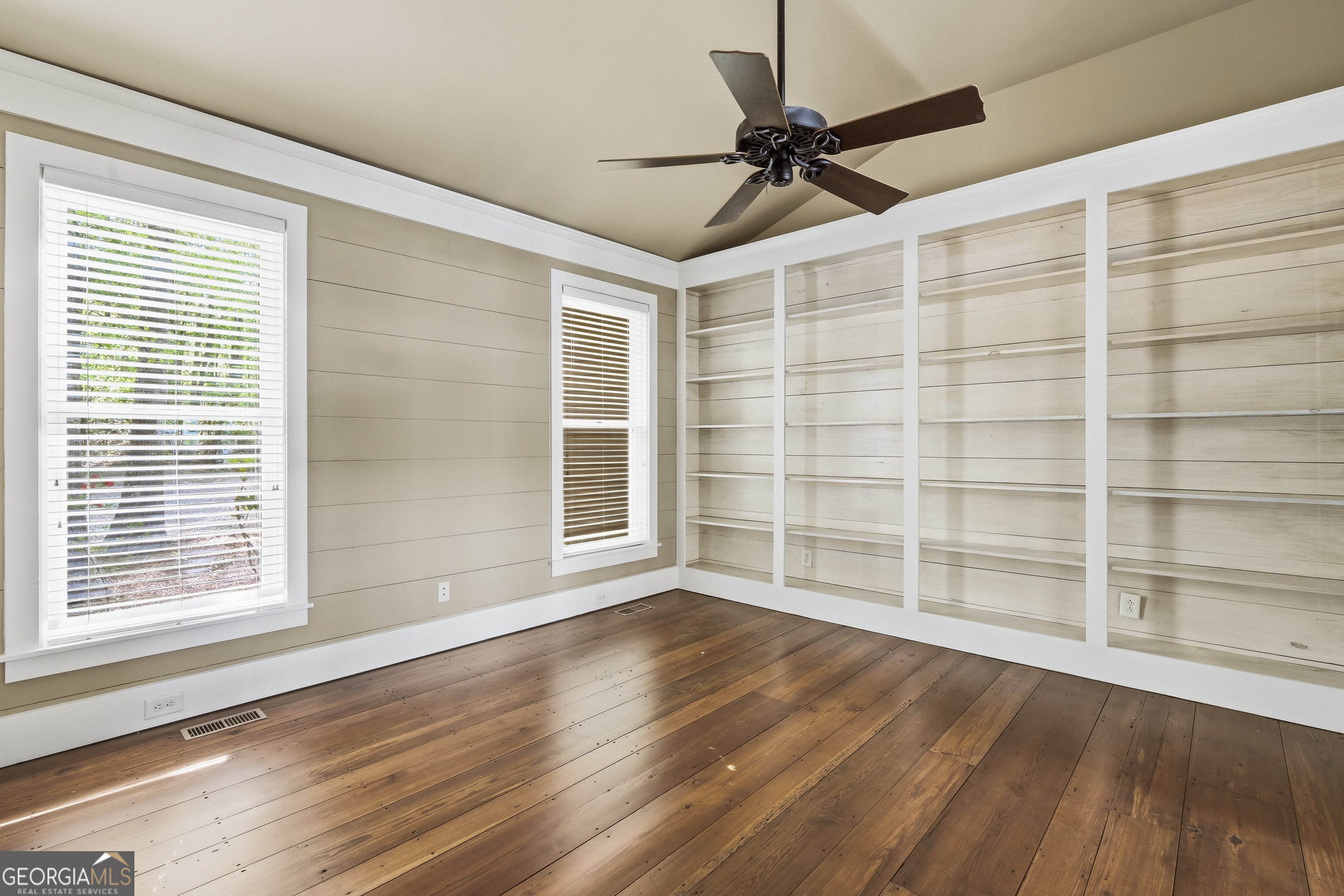 57 Birch Lane Sparta, GA 31087 - Photo 22 of 61 a view of an empty room with a window and wooden floor