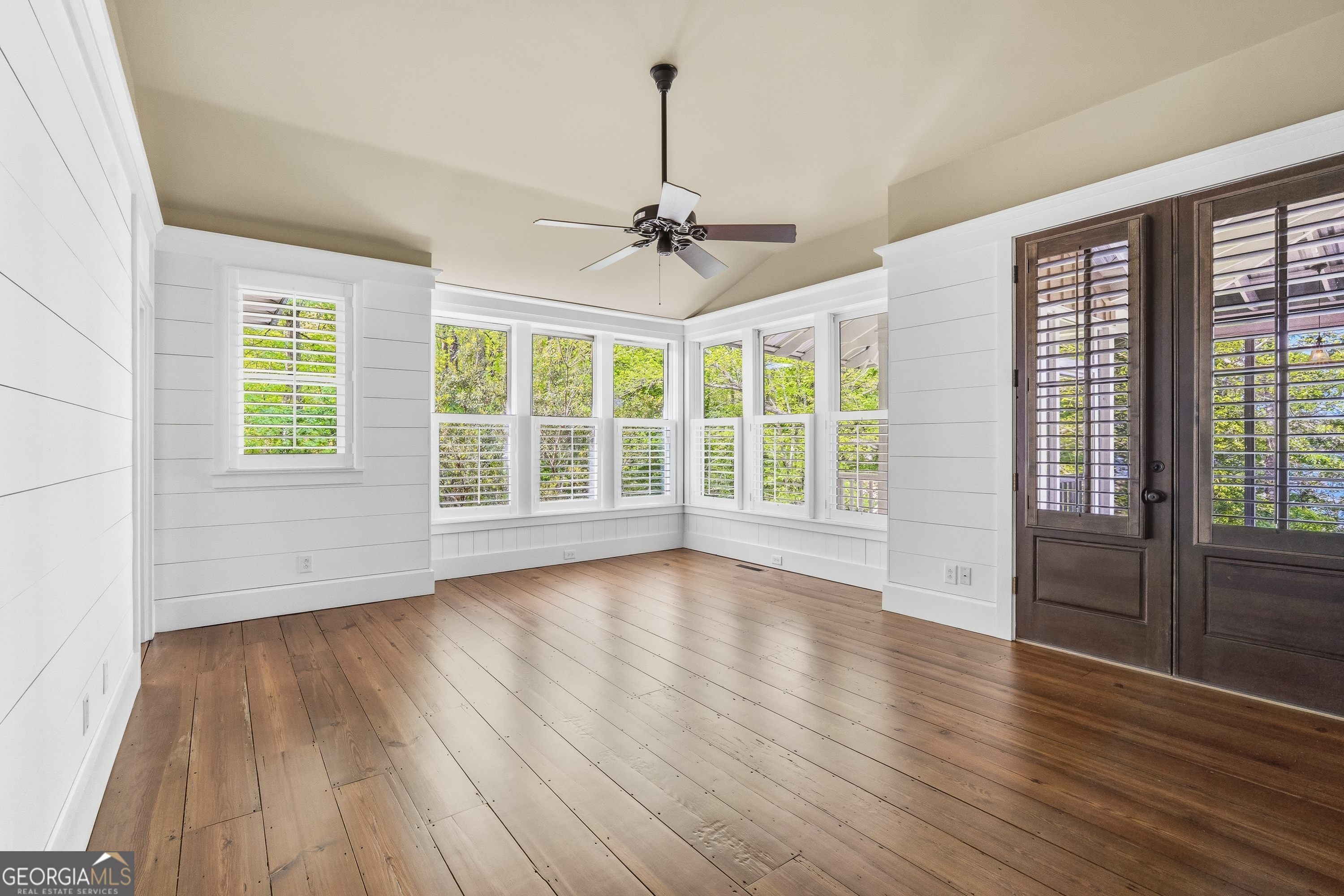 57 Birch Lane Sparta, GA 31087 - Photo 25 of 61 a view of an empty room with wooden floor and a window