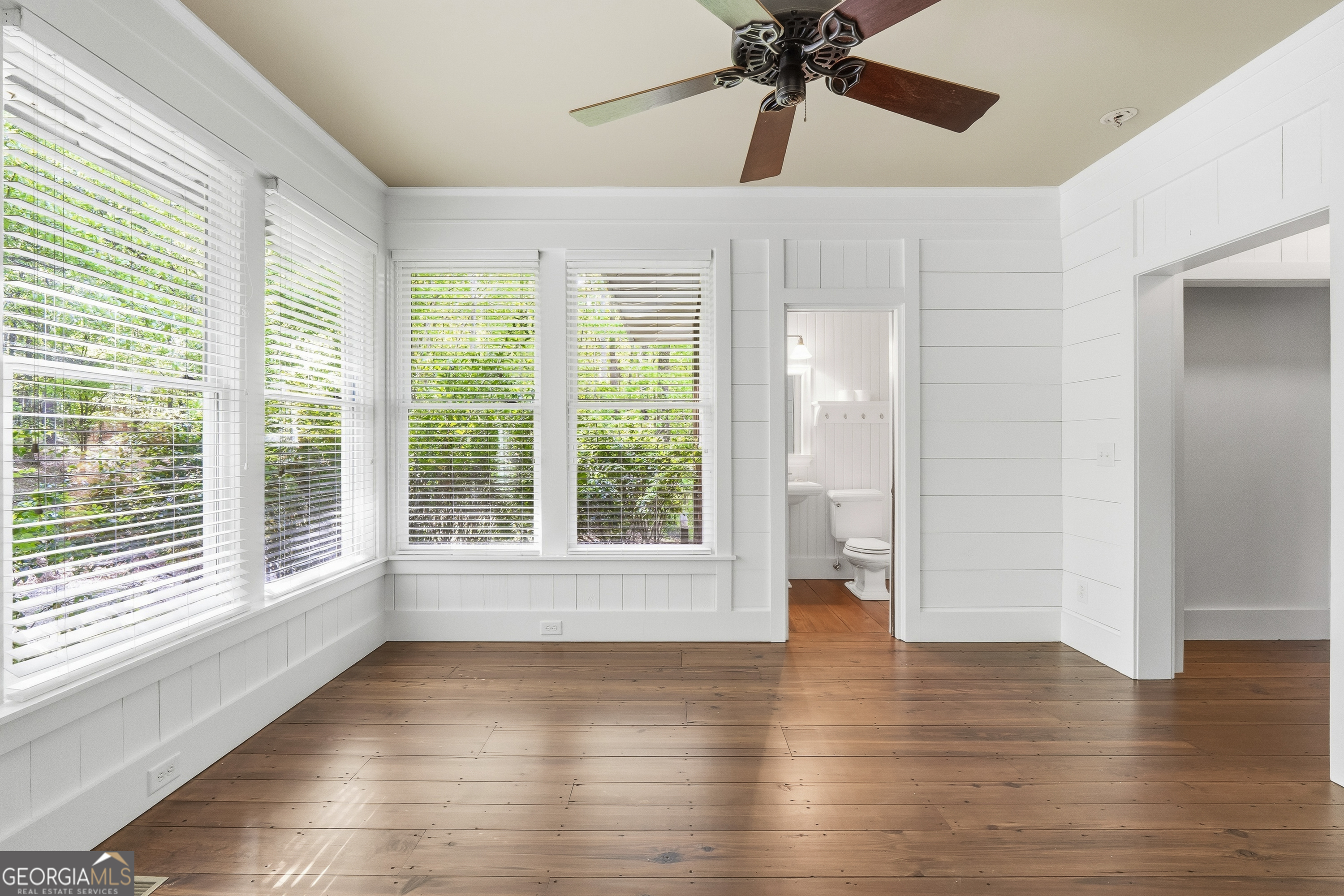 57 Birch Lane Sparta, GA 31087 - Photo 29 of 61 a view of an empty room with wooden floor and a window