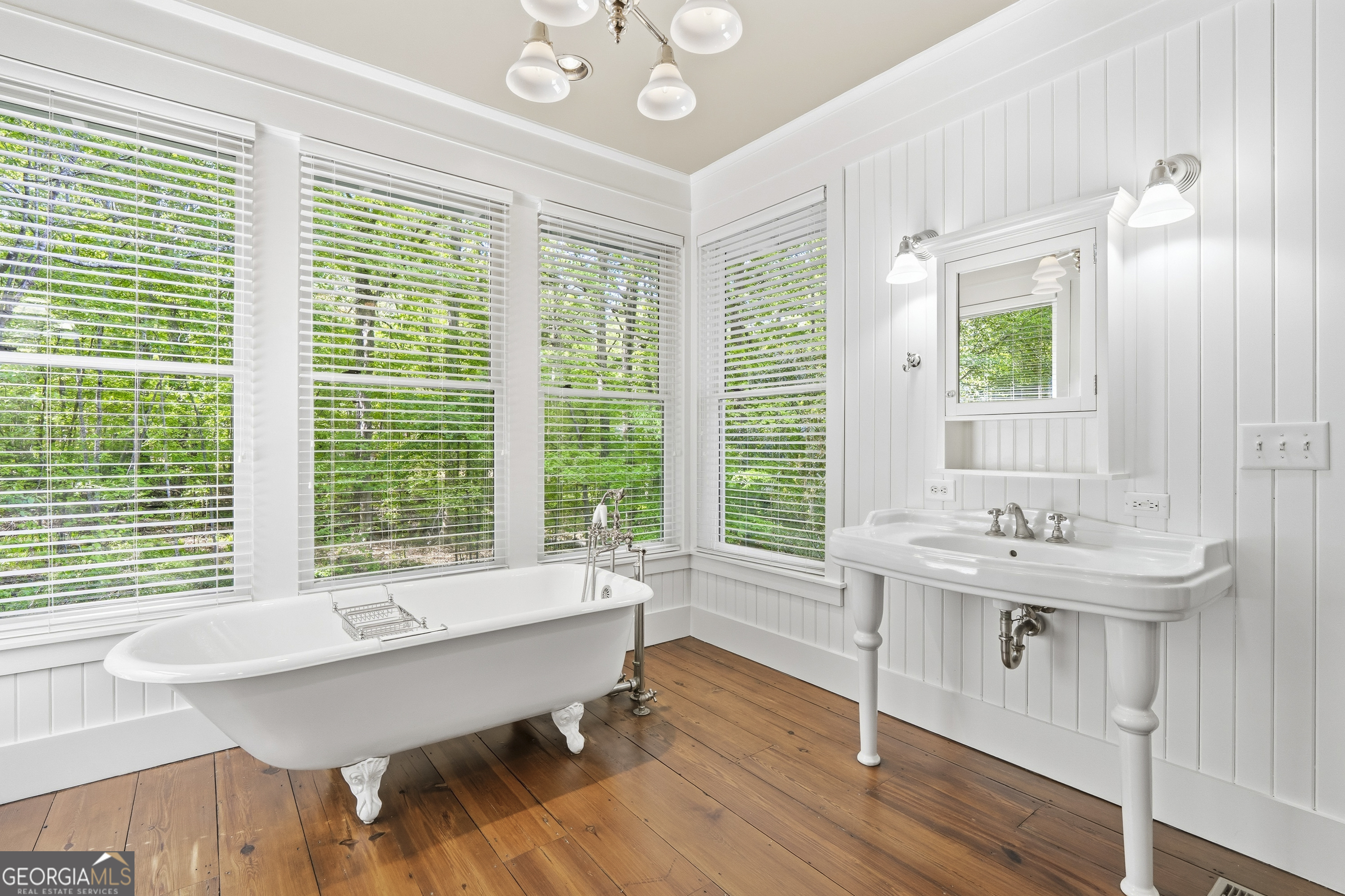 57 Birch Lane Sparta, GA 31087 - Photo 32 of 61 a bathroom with a sink and a large mirror
