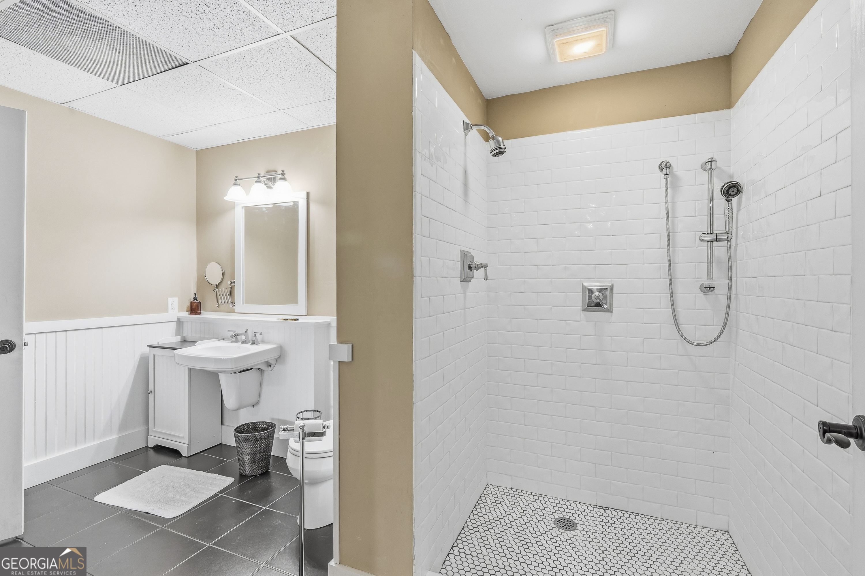 57 Birch Lane Sparta, GA 31087 - Photo 49 of 61 a bathroom with a sink mirror toilet and shower