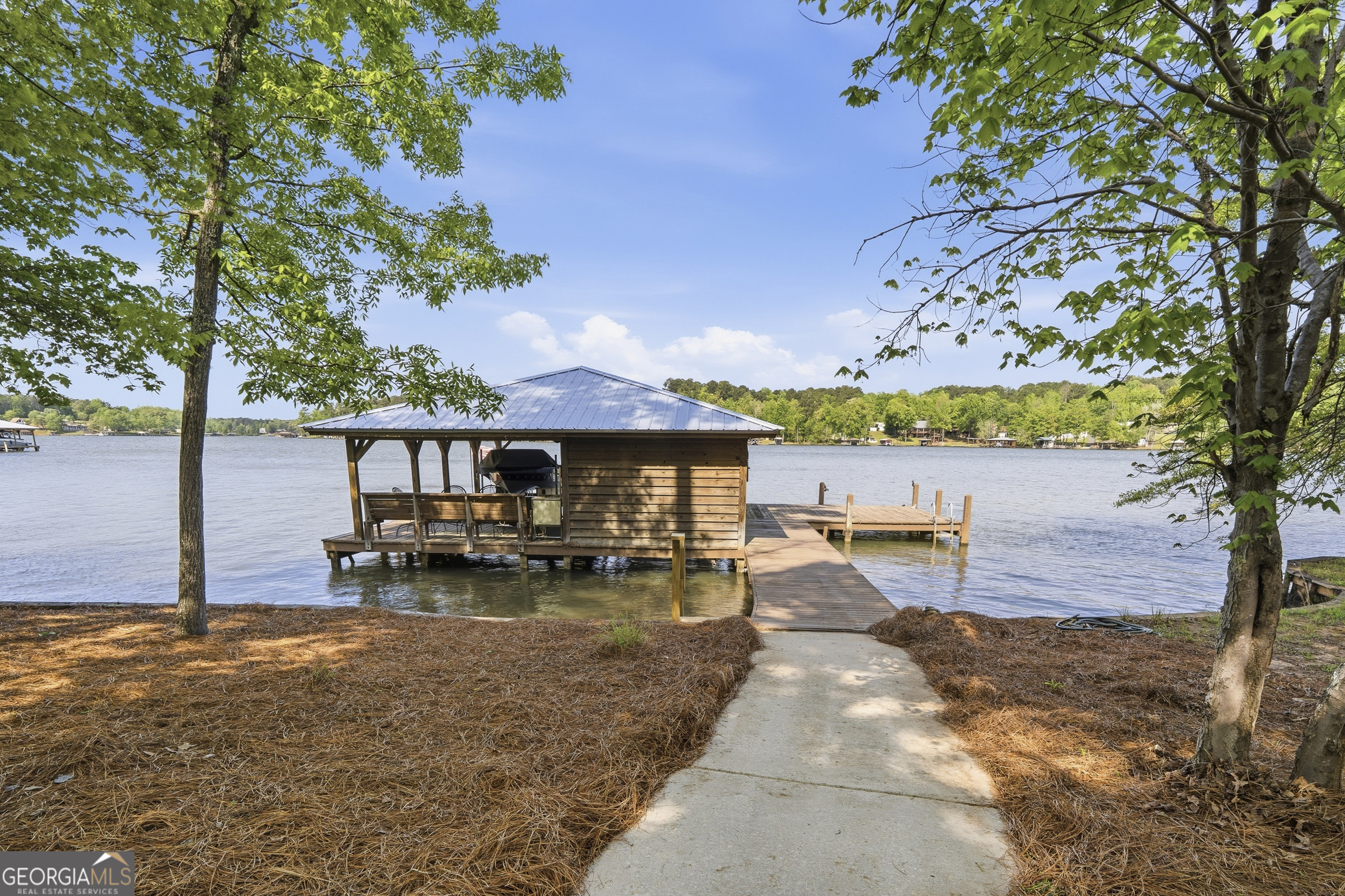 57 Birch Lane Sparta, GA 31087 - Photo 53 of 61 a backyard of a house with table and chairs