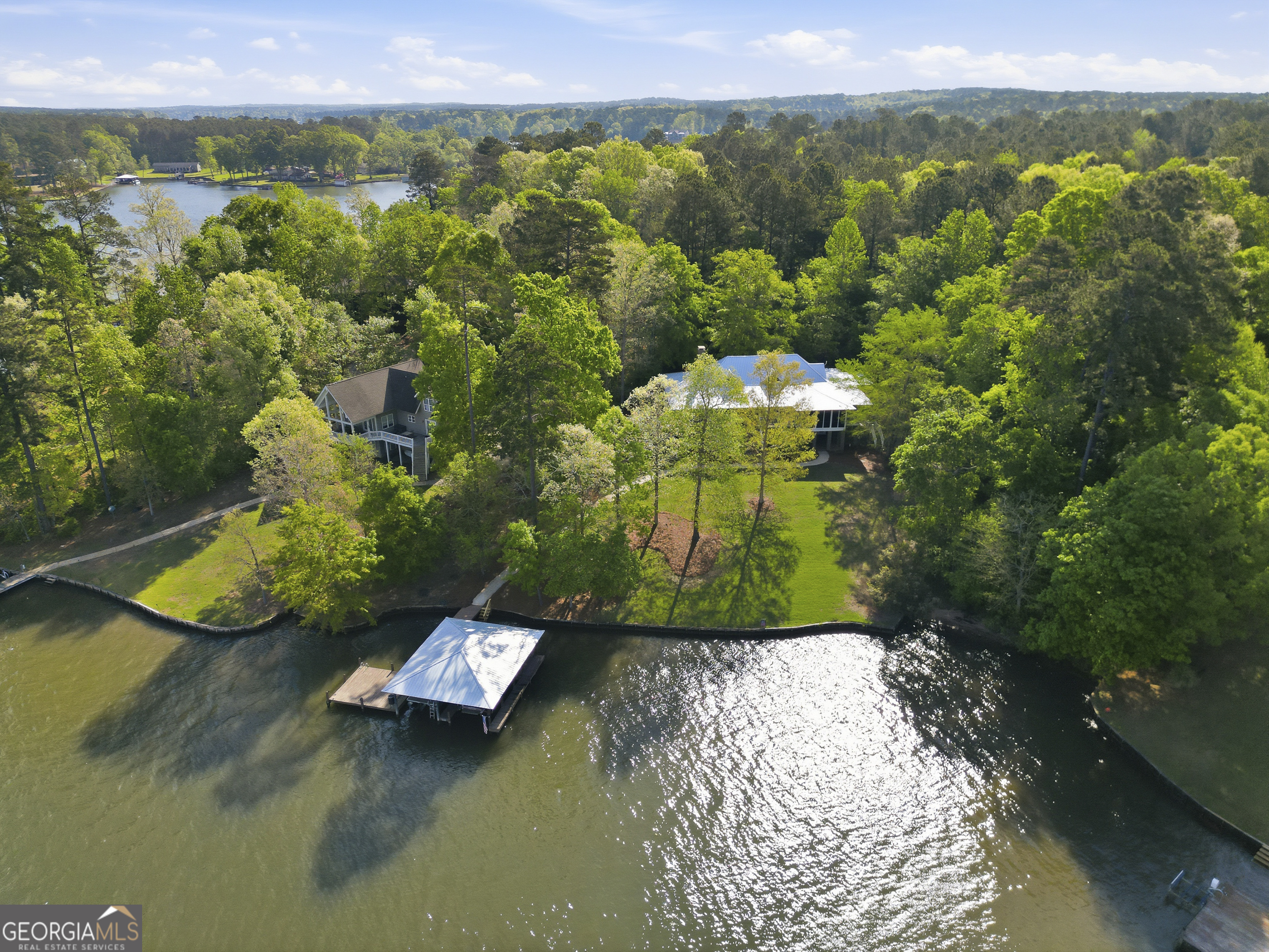 57 Birch Lane Sparta, GA 31087 - Photo 55 of 61 a view of a lake with a mountain in the background