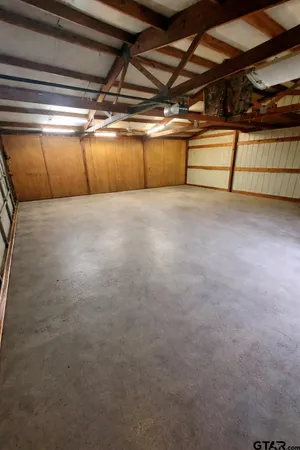 a view of a swimming pool with a yard