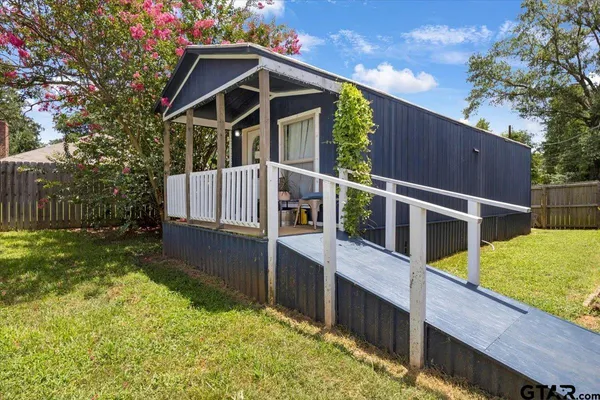 a bathroom with a sink vanity and a mirror