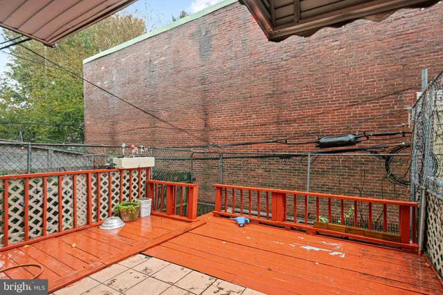a view of a balcony with wooden floor