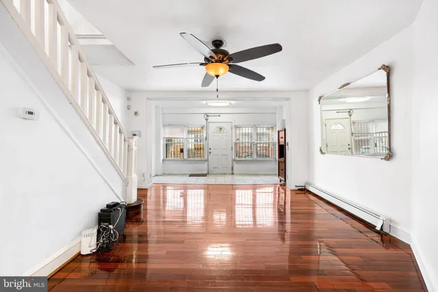 a view of an entryway with wooden floor
