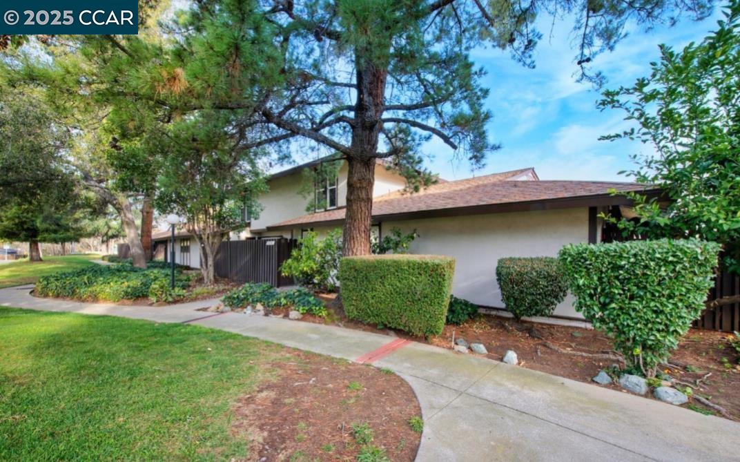 5434 Roundtree Court, Unit C Concord, CA 94521 - Photo 1 of 23 front view of a house with a yard
