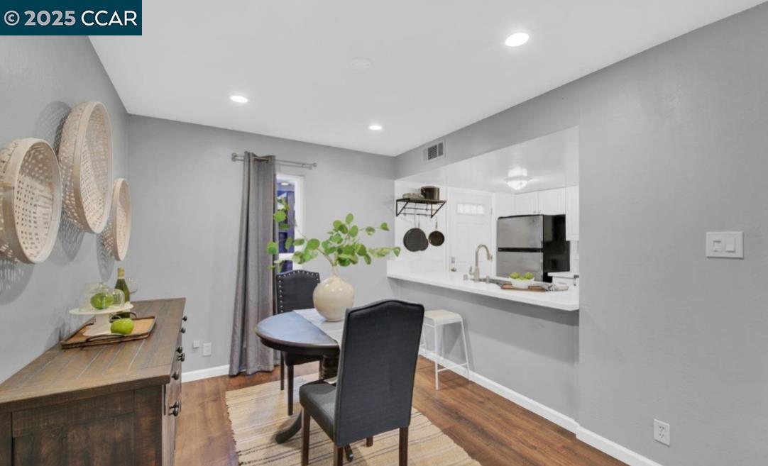 5434 Roundtree Court, Unit C Concord, CA 94521 - Photo 11 of 23 a dining room with furniture and a potted plant