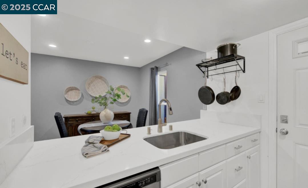 5434 Roundtree Court, Unit C Concord, CA 94521 - Photo 14 of 23 a bathroom with a sink and a mirror
