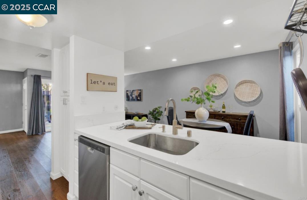 5434 Roundtree Court, Unit C Concord, CA 94521 - Photo 15 of 23 a kitchen with a sink and a refrigerator