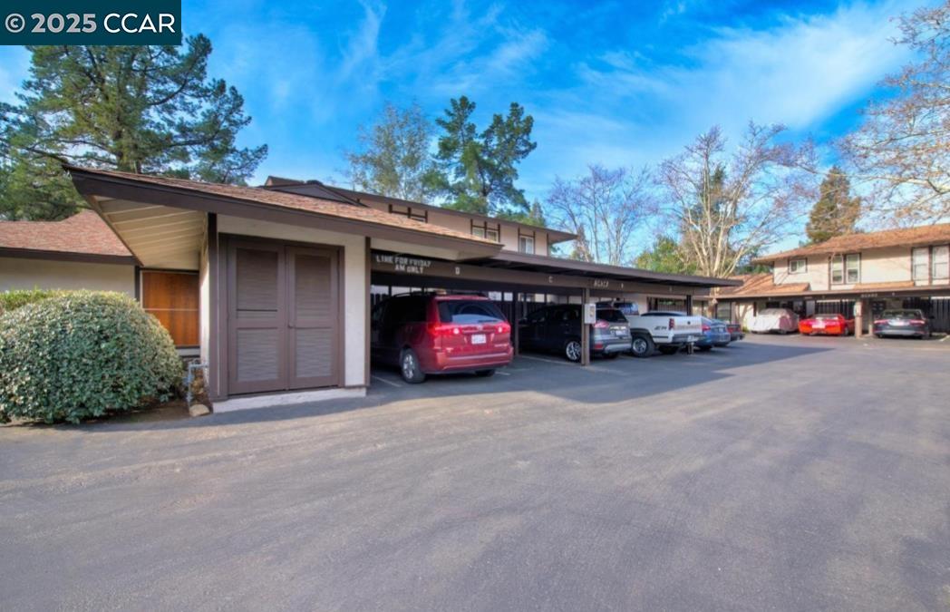 5434 Roundtree Court, Unit C Concord, CA 94521 - Photo 23 of 23 a view of a car park in front of a building