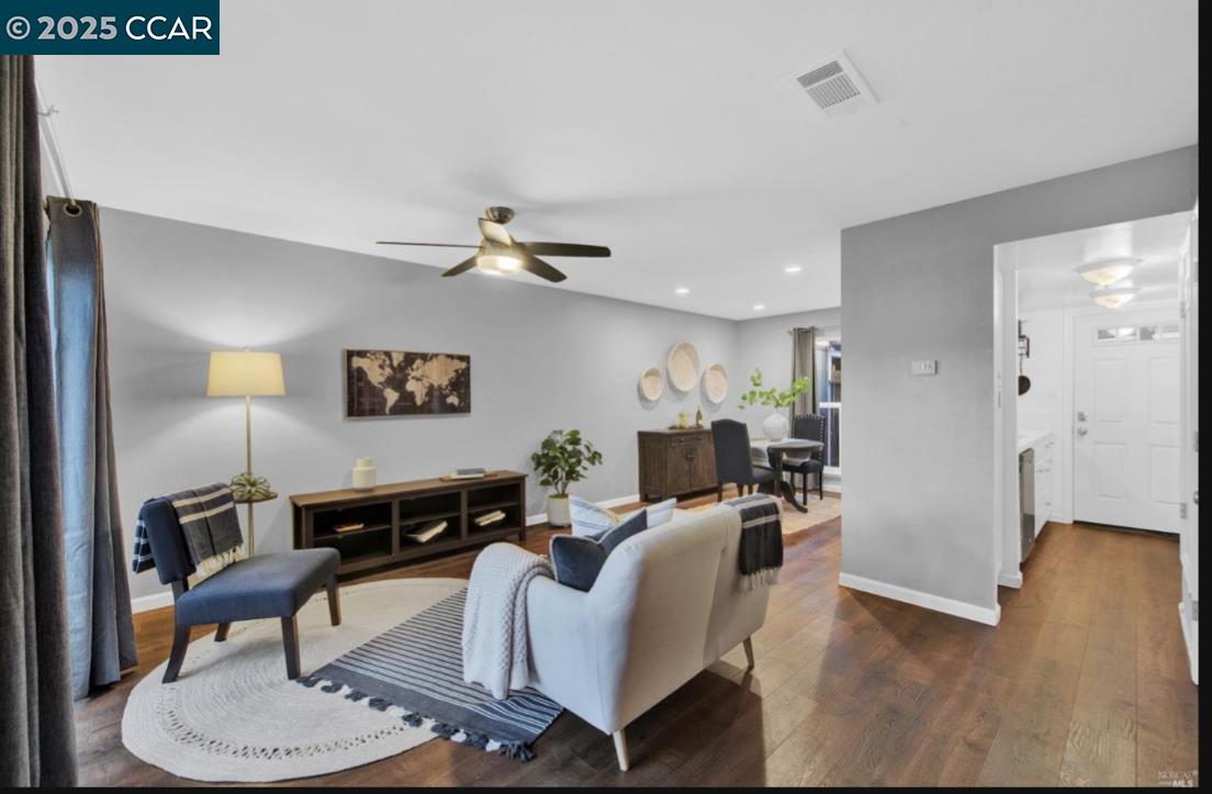 5434 Roundtree Court, Unit C Concord, CA 94521 - Photo 6 of 23 a living room with furniture and a wooden floor