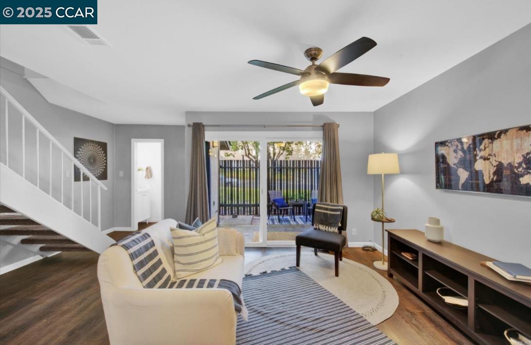 5434 Roundtree Court, Unit C Concord, CA 94521 - Photo 8 of 23 a living room with furniture and a wooden floor