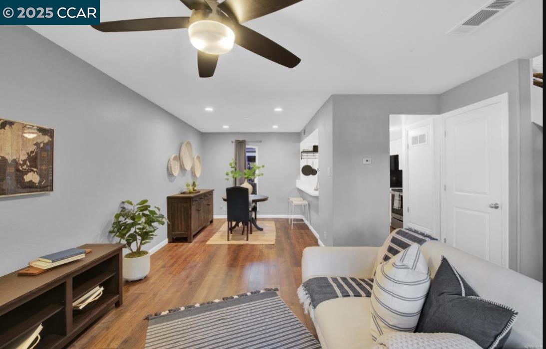 5434 Roundtree Court, Unit C Concord, CA 94521 - Photo 10 of 23 a living room with furniture and a wooden floor