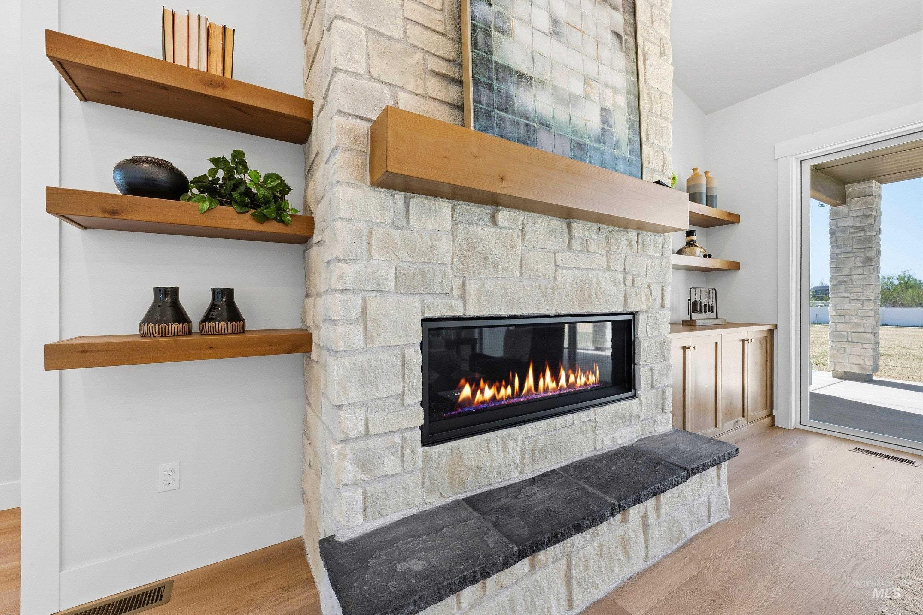 24897 Ardmore Court Caldwell, ID 83607 - Photo 26 of 47 Detailed view of wood finished floors and a fireplace