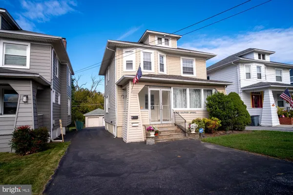 a view of a building with a yard