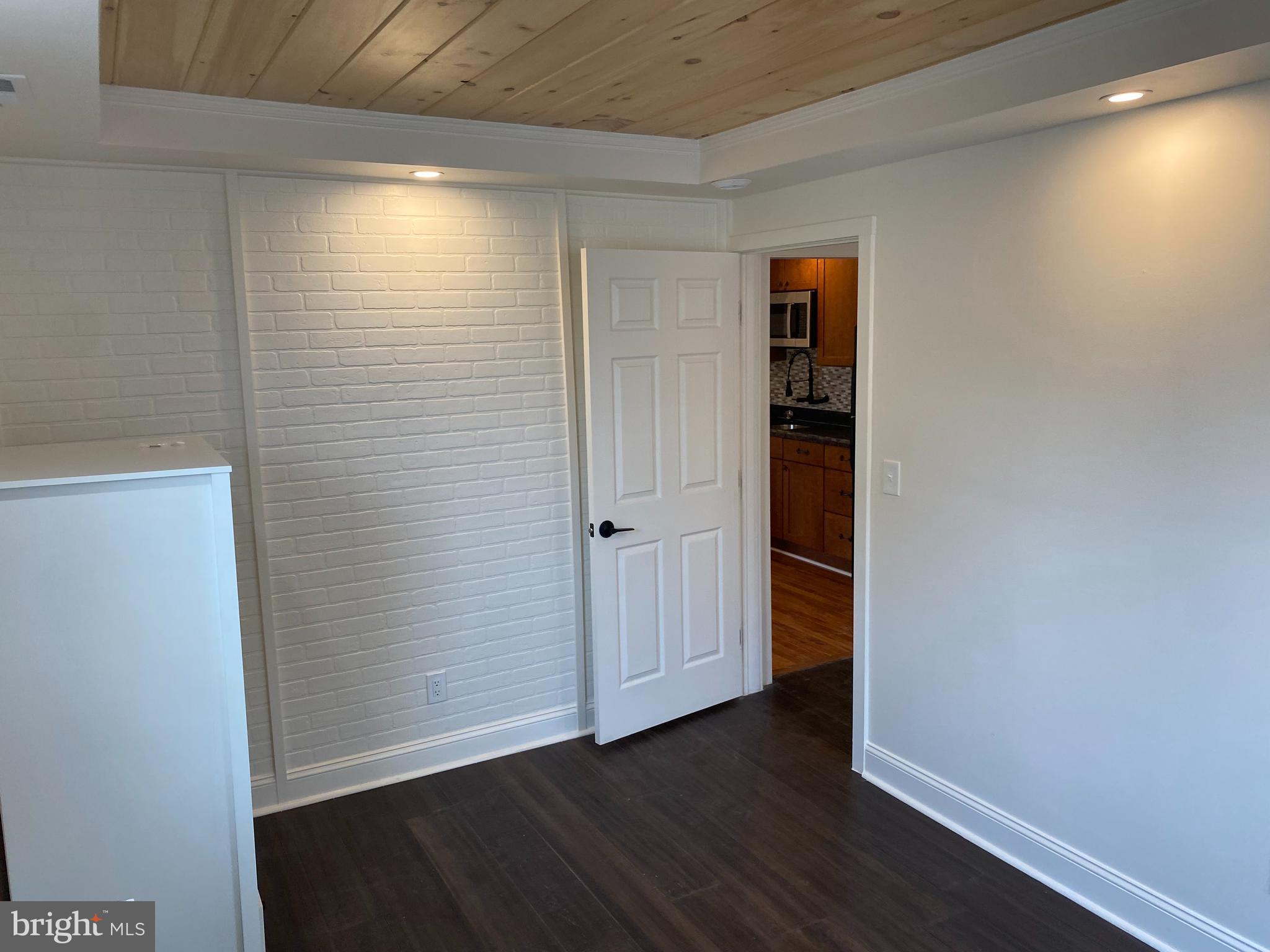 1416 Sulphur Spring Road Halethorpe, MD 21227 - Photo 14 of 42 a view of an empty room with wooden floor