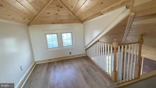 a view of entryway with wooden floor