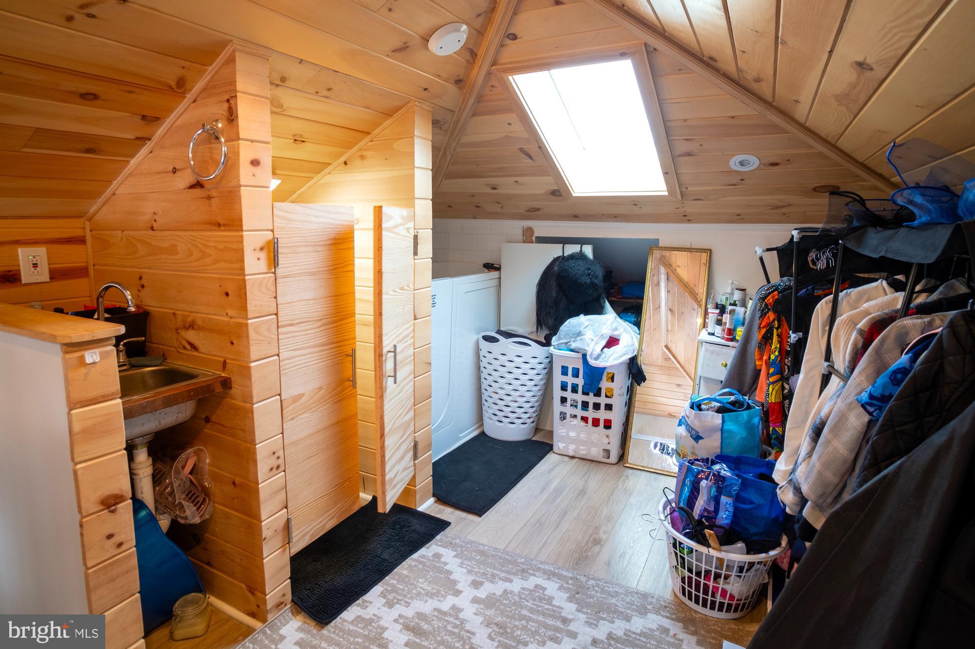 1416 Sulphur Spring Road Halethorpe, MD 21227 - Photo 25 of 42 a view of walk in closet with clothes and shoes