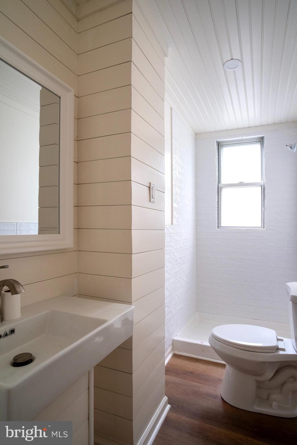 1416 Sulphur Spring Road Halethorpe, MD 21227 - Photo 40 of 42 a bathroom with a sink a toilet and shower