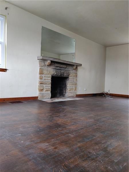 2066 Lindsay Road Pittsburgh, PA 15221 - Photo 2 of 13 Living room with decorative stone fireplace