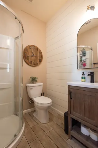 a bathroom with a toilet sink and shower
