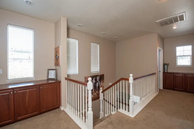 a view of hallway with windows