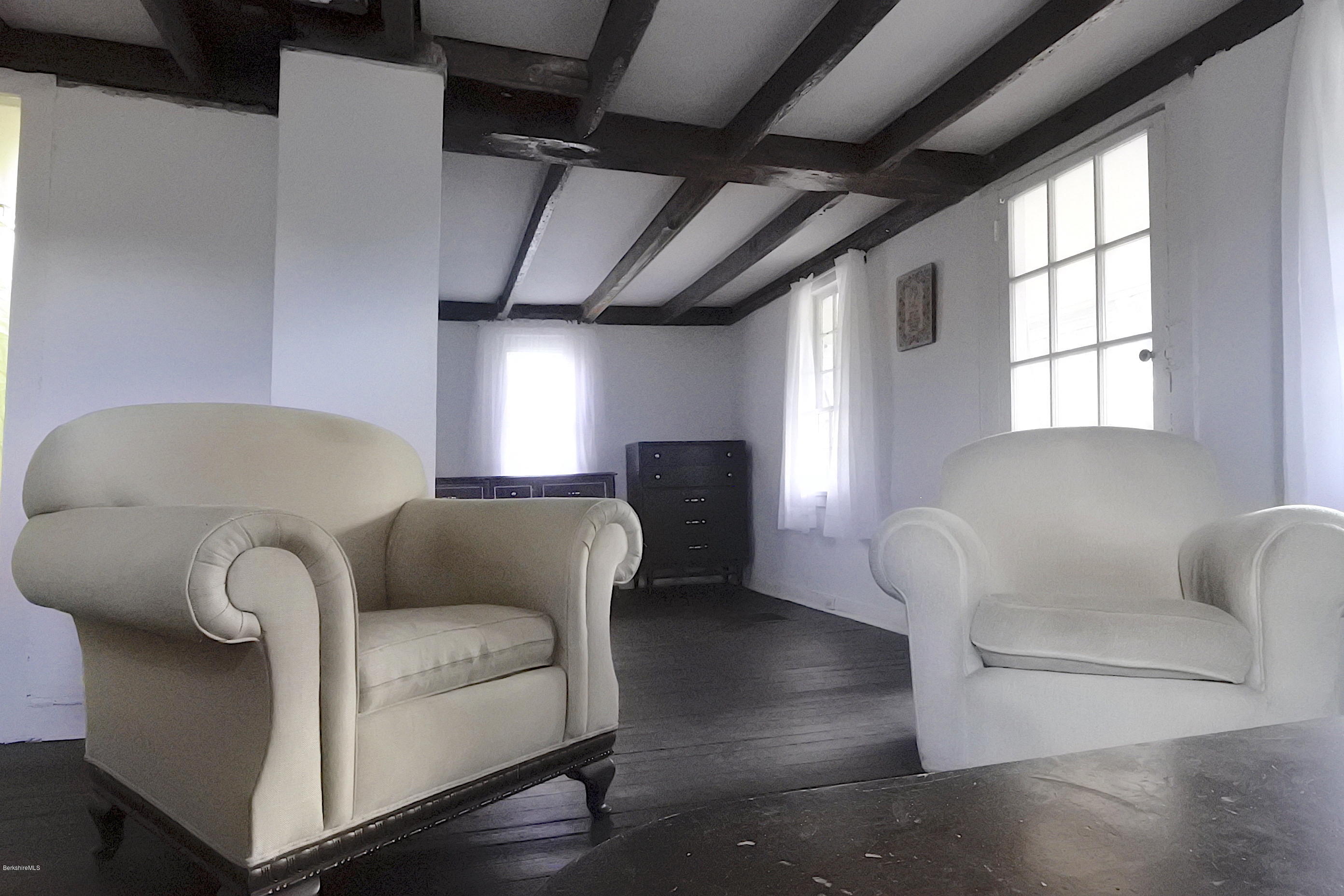 6 West Stockbridge Road Stockbridge, MA 01262 - Photo 7 of 15 a living room with furniture and a potted plant
