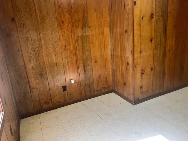 a view of an entrance with wooden walls