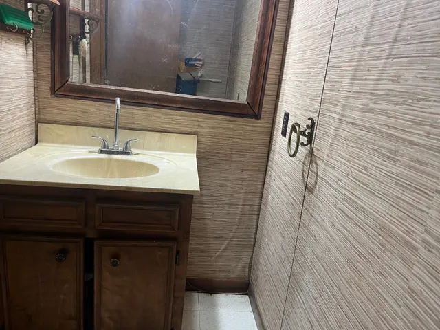 a bathroom with a sink and a mirror