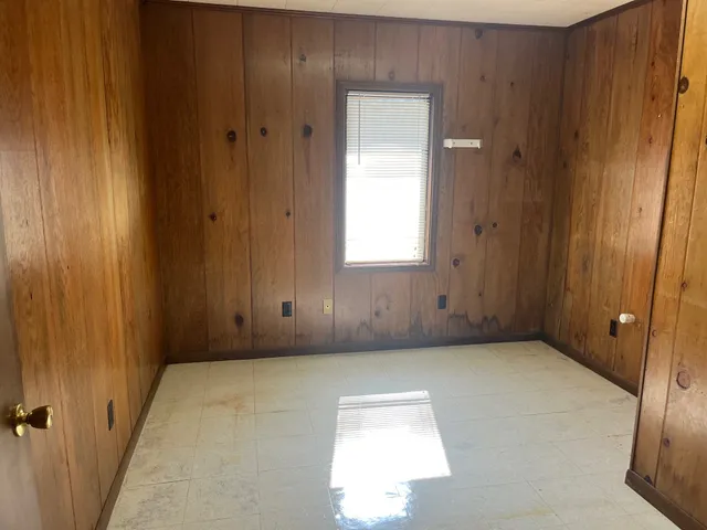 an empty room with windows