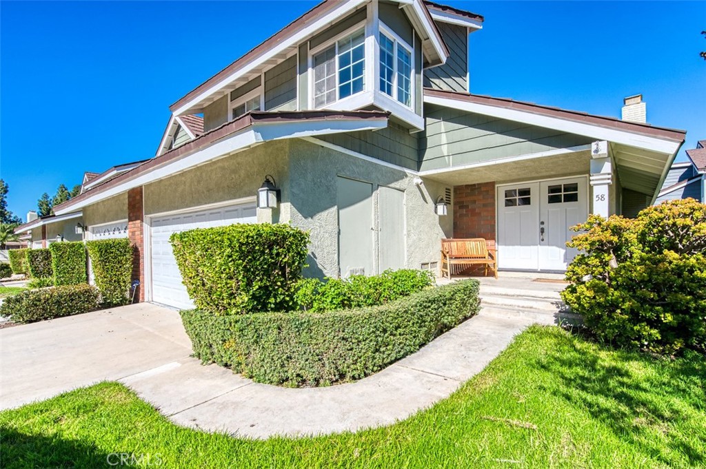 58 Rockwood Irvine, CA 92614 - Photo 1 of 1 a view of a white house with a small yard and plants