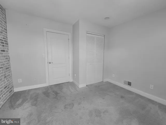 a kitchen with stainless steel appliances granite countertop a refrigerator a stove a sink and a microwave