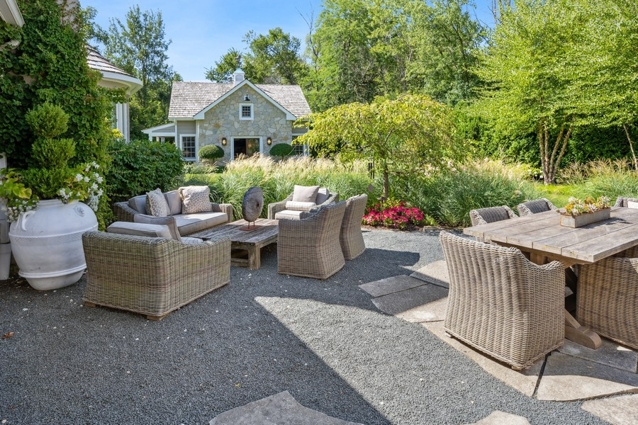 422 Sunset Ridge Road Northfield, IL 60093 - Photo 11 of 52 a view of a patio with couches and potted plants